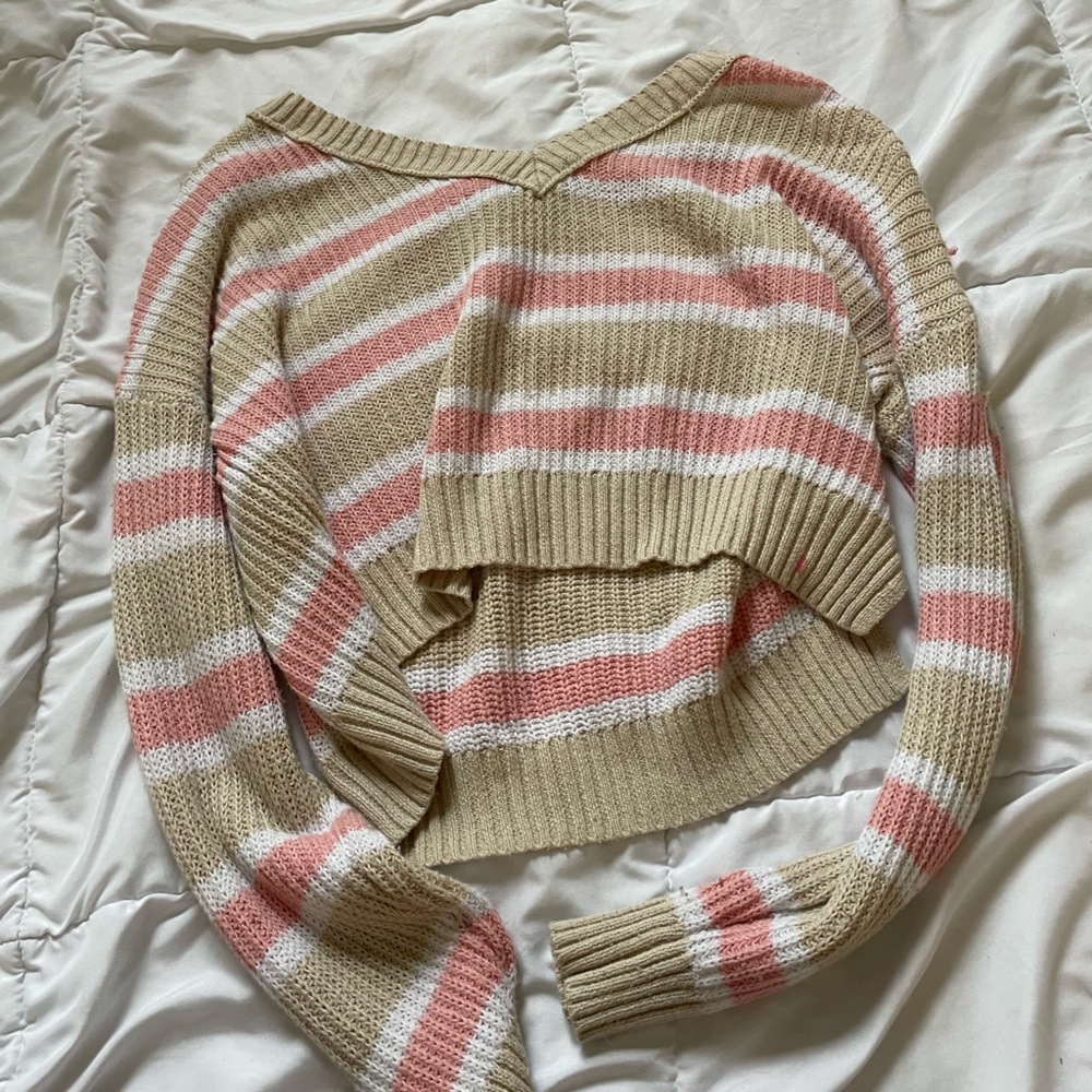 cropped pink, white, and tannish color sweater